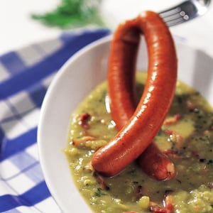 A Sausage is Dangled over a Pea Soup