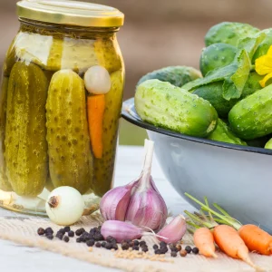 Jar with pickled cucumbers and spices