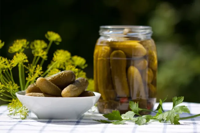 Pickles In Glass Jars And Plate