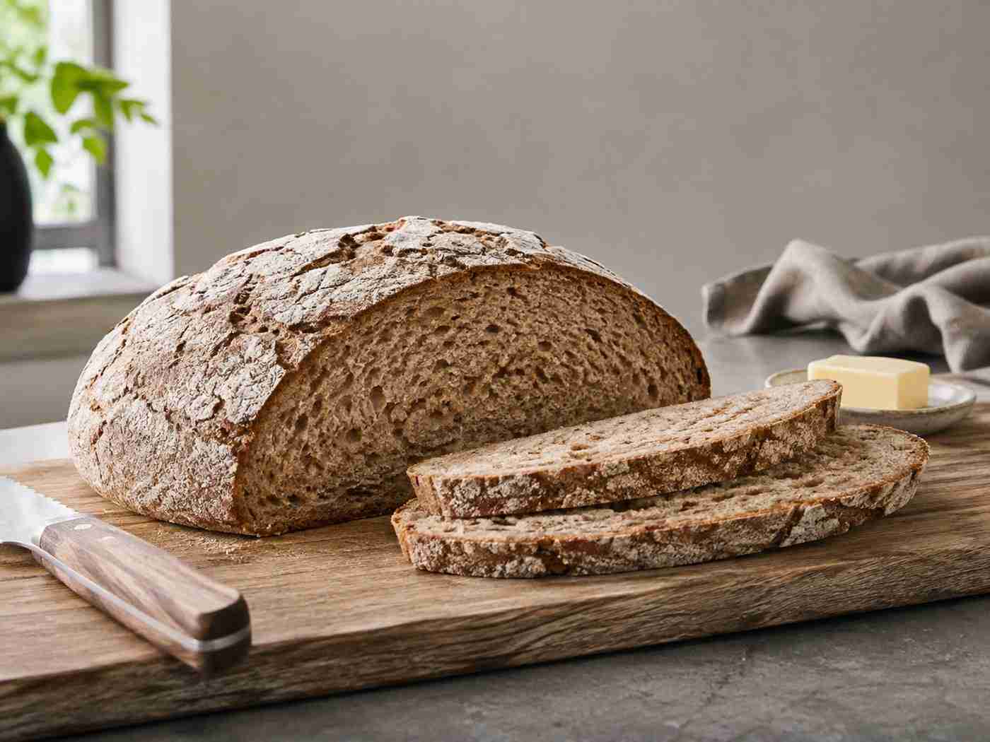 Rustic German Bauernbrot wheat bread loaf with a crisp crust and sliced crumb